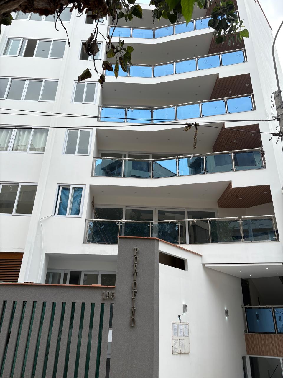The facade — curved glass balconies