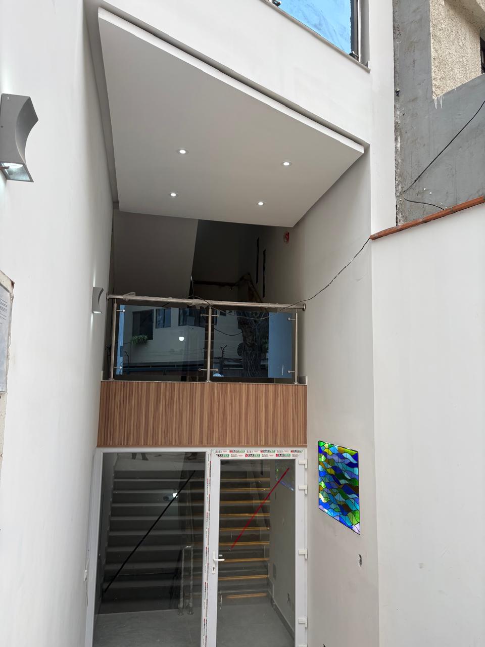 Double-height lobby with glass mural