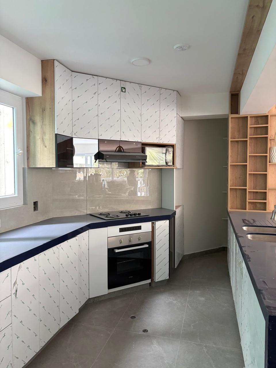 Kitchen — white cabinets and blue quartz